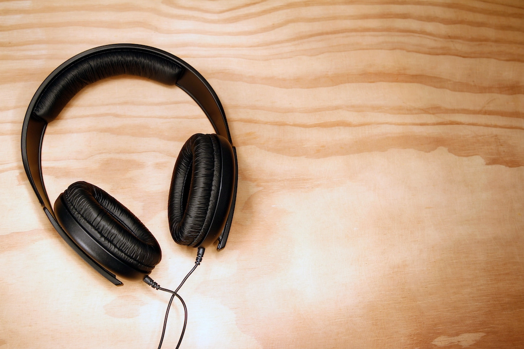 headphones on a wood-grained surface